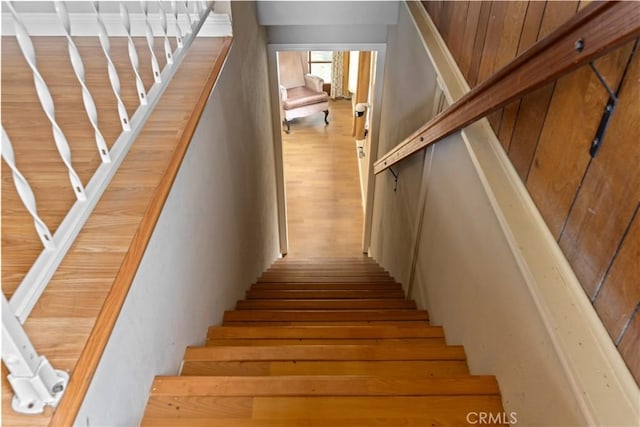 stairs with wood-type flooring