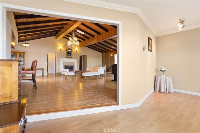 interior space with crown molding, vaulted ceiling with beams, wood-type flooring, wood ceiling, and a chandelier