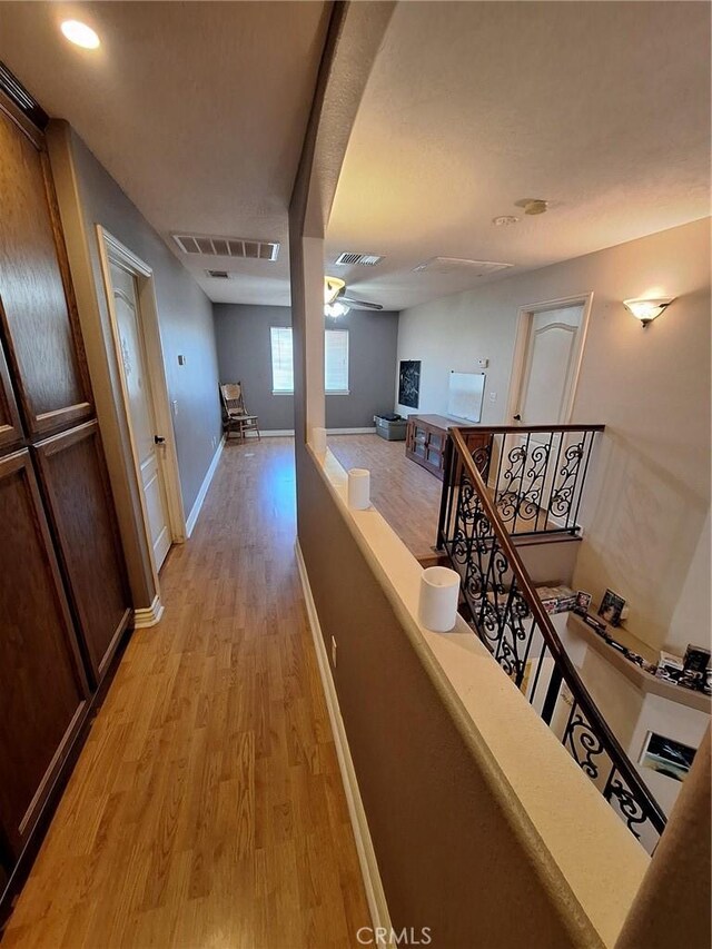 hall with light hardwood / wood-style flooring