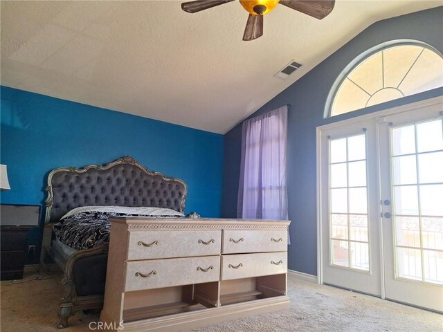 carpeted bedroom featuring ceiling fan, french doors, and vaulted ceiling