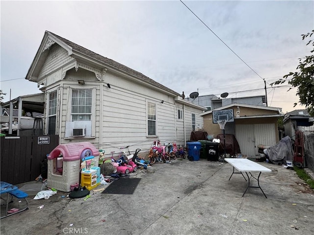 exterior space with cooling unit, a patio, and fence