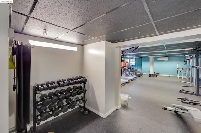 exercise room with a drop ceiling