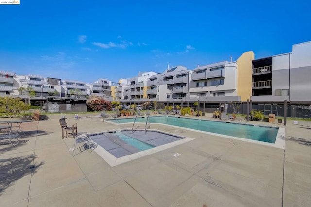 view of swimming pool with a patio area