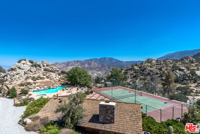 view of sport court with a mountain view