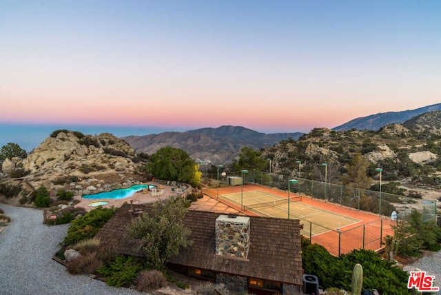 view of sport court with a mountain view