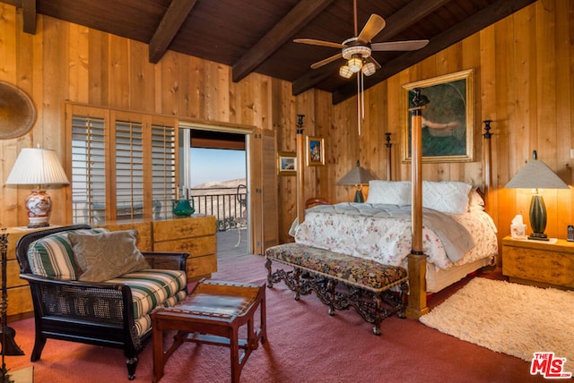 bedroom with ceiling fan, lofted ceiling with beams, wood walls, carpet floors, and wood ceiling