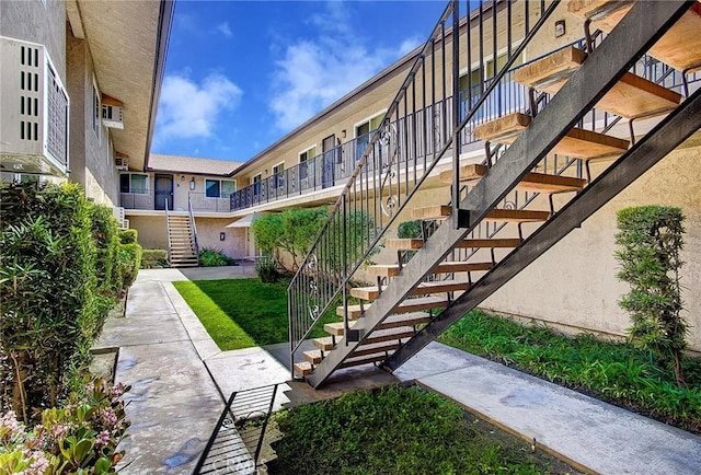 view of community featuring stairway