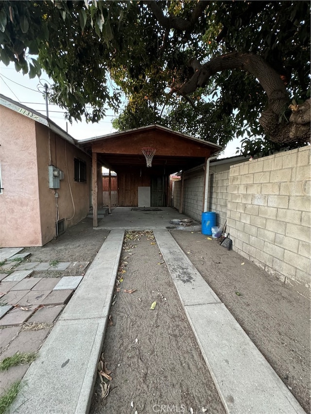 exterior space with a carport