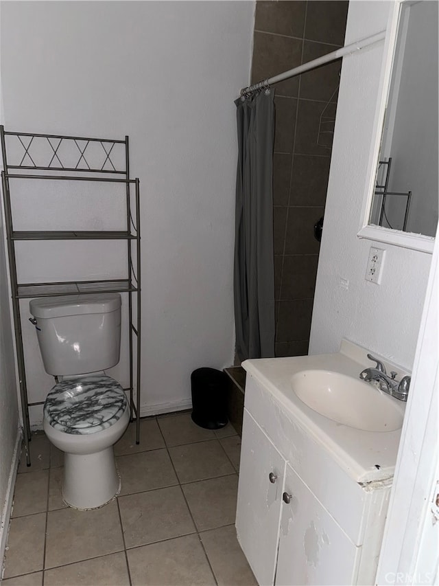 bathroom featuring vanity, toilet, a shower with curtain, and tile patterned flooring