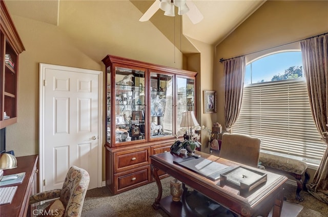 carpeted home office with vaulted ceiling and ceiling fan