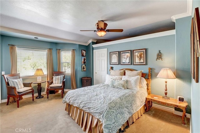 carpeted bedroom featuring a textured ceiling, ceiling fan, and crown molding