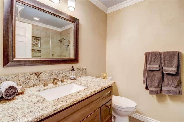 bathroom with vanity, toilet, and ornamental molding