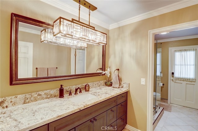 bathroom with tile patterned flooring, vanity, toilet, and crown molding