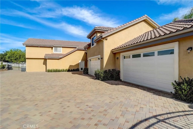 mediterranean / spanish-style house featuring a garage