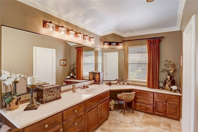 bathroom featuring crown molding and vanity