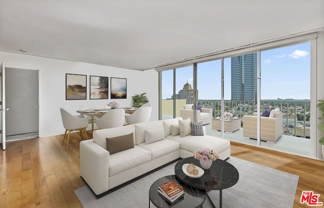 living room featuring hardwood / wood-style floors and floor to ceiling windows