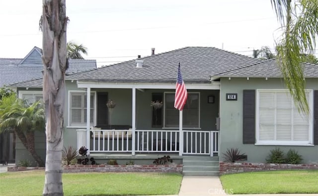 bungalow with a front lawn