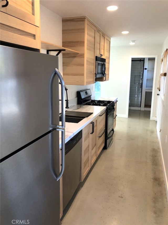 kitchen with stainless steel appliances, sink, and light brown cabinets