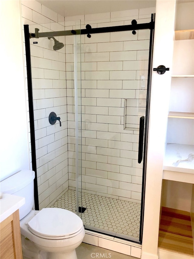 bathroom with vanity, a baseboard heating unit, toilet, and walk in shower