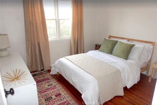 bedroom featuring wood-type flooring