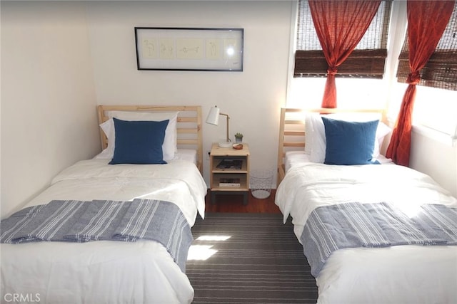 bedroom featuring dark hardwood / wood-style flooring