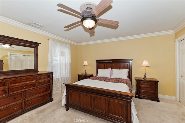 bedroom with ceiling fan, light colored carpet, and crown molding