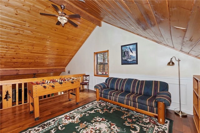 bedroom featuring lofted ceiling with beams, wood-type flooring, ceiling fan, and wooden ceiling