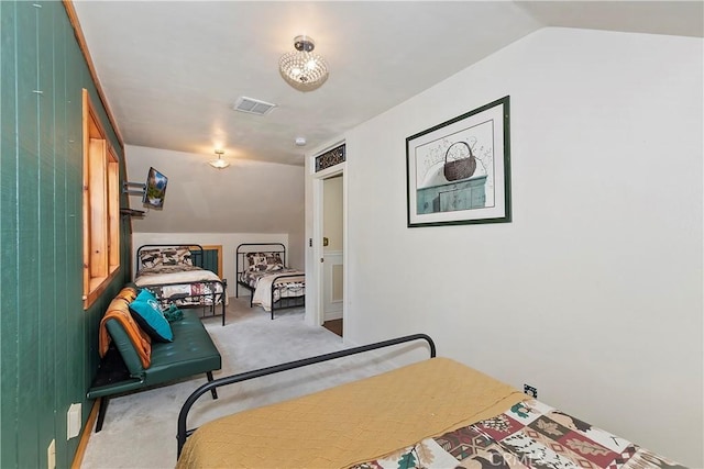 bedroom featuring visible vents, carpet, and lofted ceiling