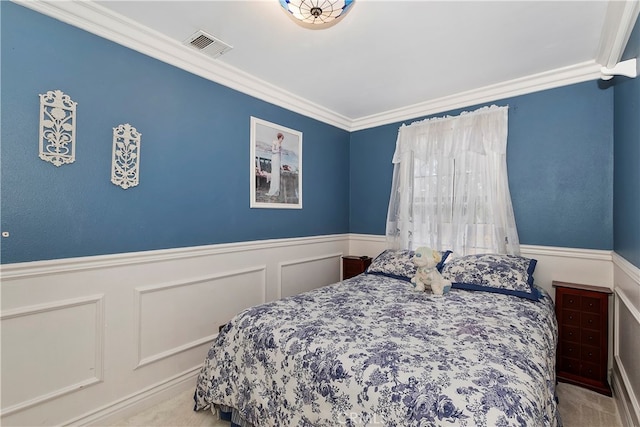 carpeted bedroom featuring crown molding