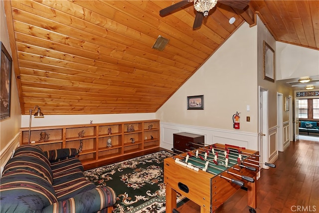 recreation room with ceiling fan, vaulted ceiling with beams, hardwood / wood-style flooring, and wood ceiling