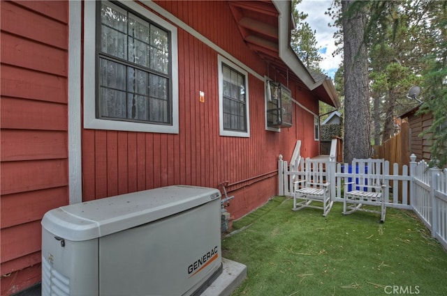 view of side of property featuring a yard