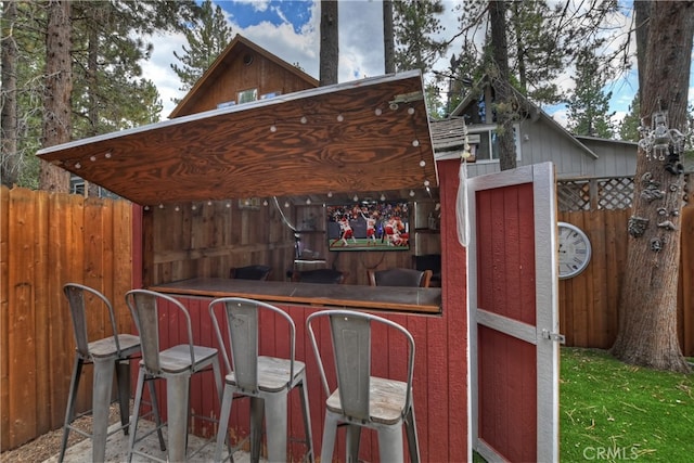 exterior space featuring a bar and a gazebo