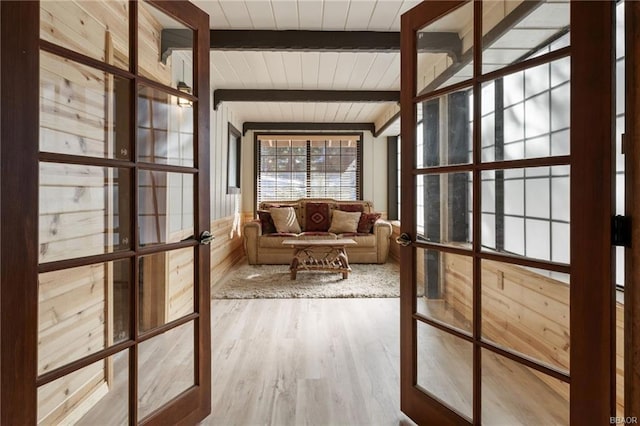 interior space featuring beam ceiling, french doors, and wooden ceiling