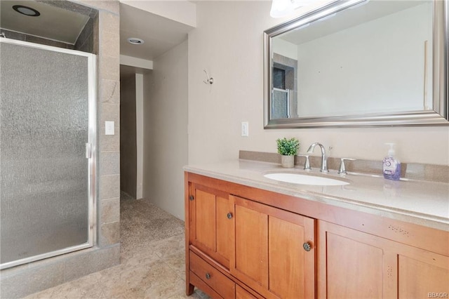 bathroom featuring vanity, walk in shower, and tile patterned flooring