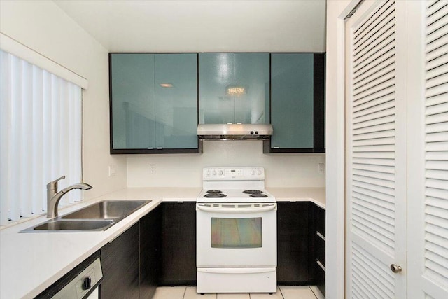 kitchen with sink, light tile patterned floors, electric range, and extractor fan