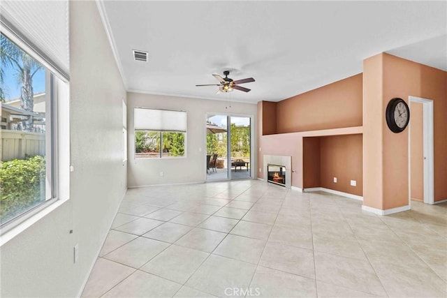 unfurnished living room with baseboards, visible vents, ceiling fan, a fireplace, and light tile patterned flooring