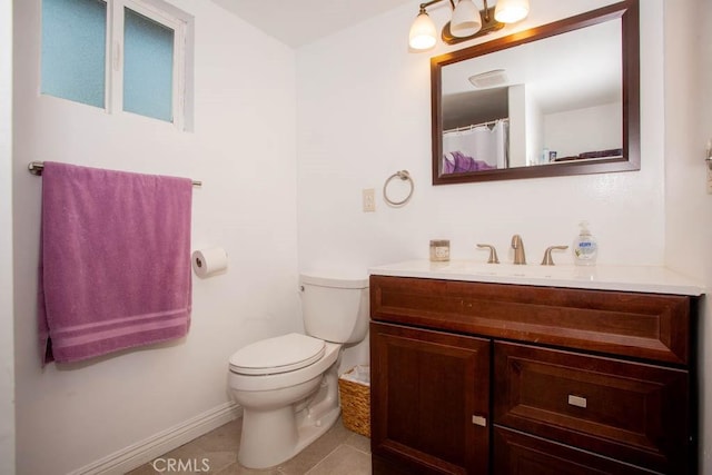 full bathroom featuring toilet, tile patterned flooring, baseboards, and vanity