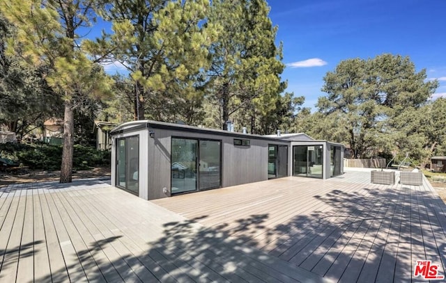 deck with a sunroom