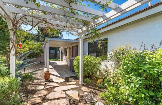 view of patio featuring a pergola and central air condition unit