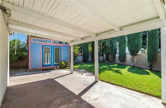 view of patio with an outbuilding