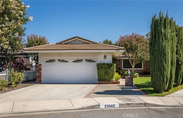 single story home with a garage