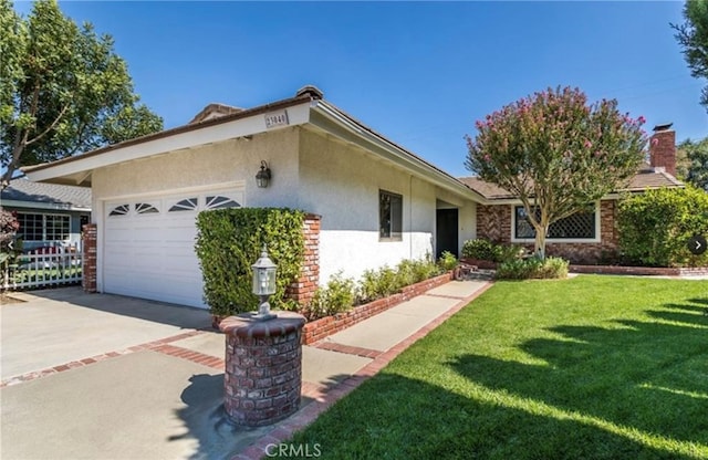 view of property exterior with a yard and a garage