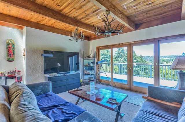 living room featuring a notable chandelier, carpet flooring, lofted ceiling with beams, and wooden ceiling