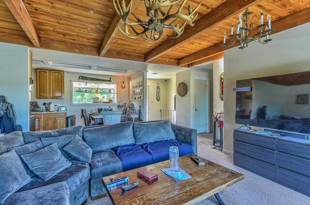 living room featuring beam ceiling, wooden ceiling, bar area, and light colored carpet