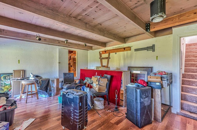 interior space with wood-type flooring, beamed ceiling, and wooden ceiling