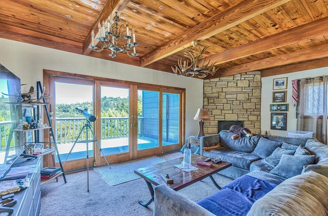 living room featuring wood ceiling, an inviting chandelier, vaulted ceiling with beams, carpet floors, and a stone fireplace