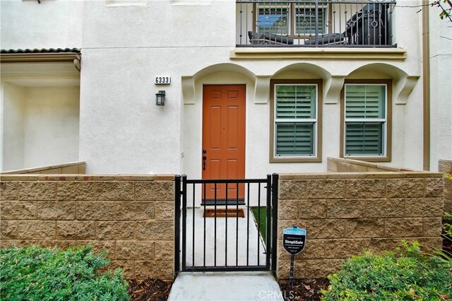 doorway to property with a balcony