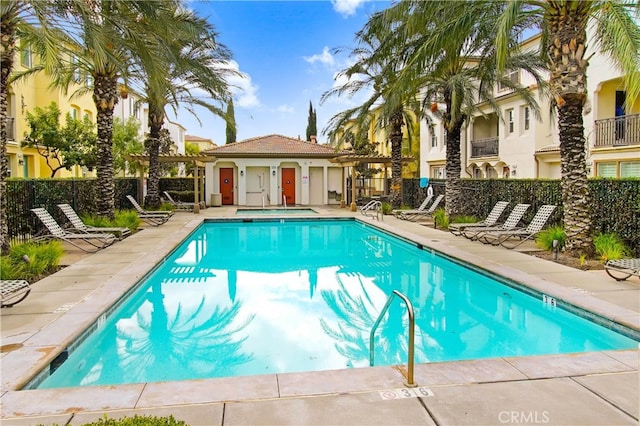 view of swimming pool with a patio