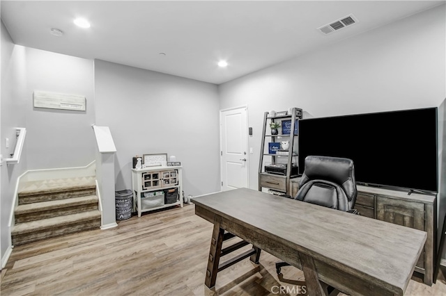 office space with light hardwood / wood-style flooring