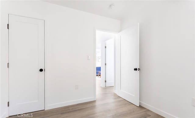 unfurnished bedroom featuring light hardwood / wood-style flooring